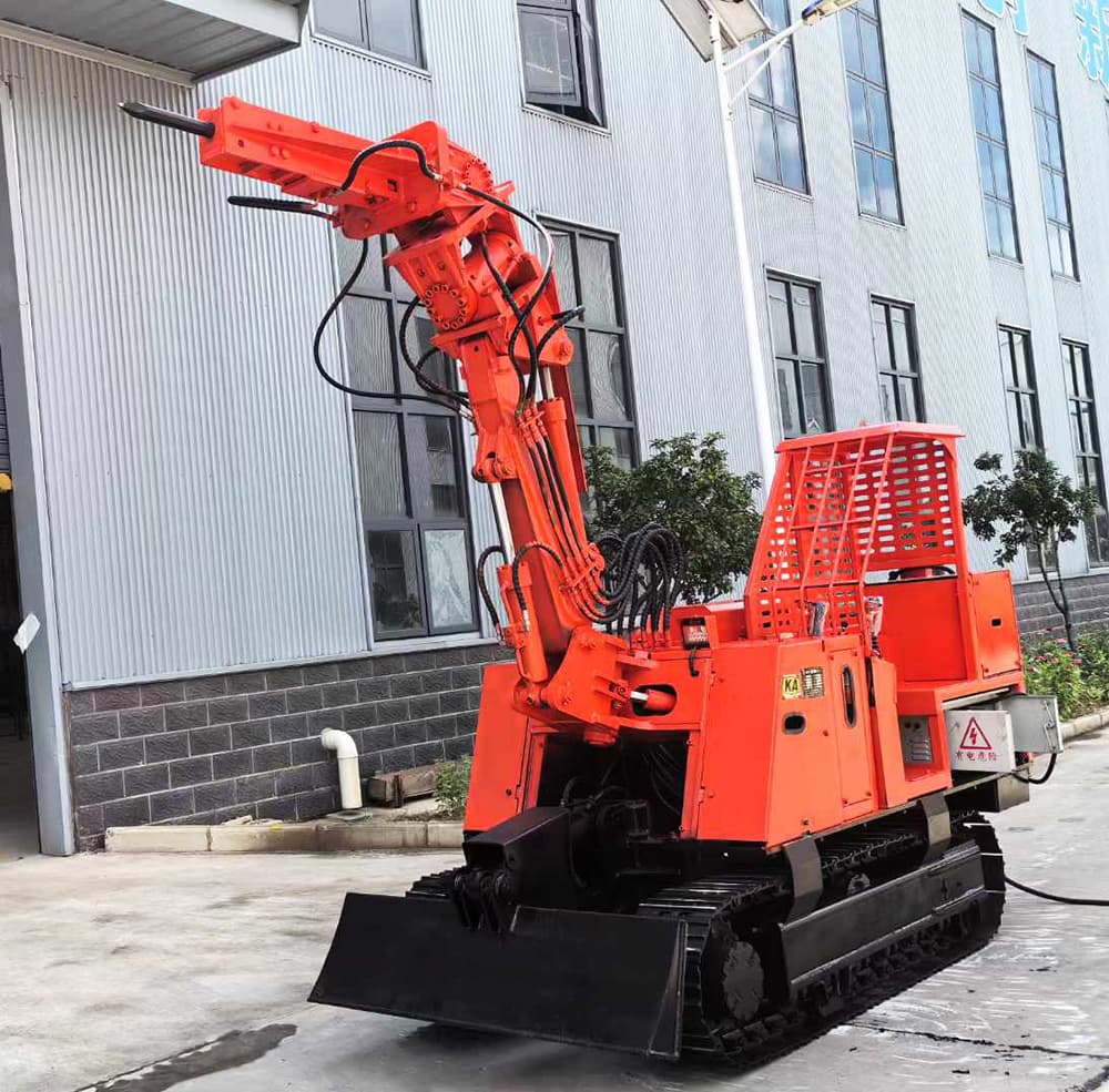 Red crawler scaling machine photographed outside a workshop