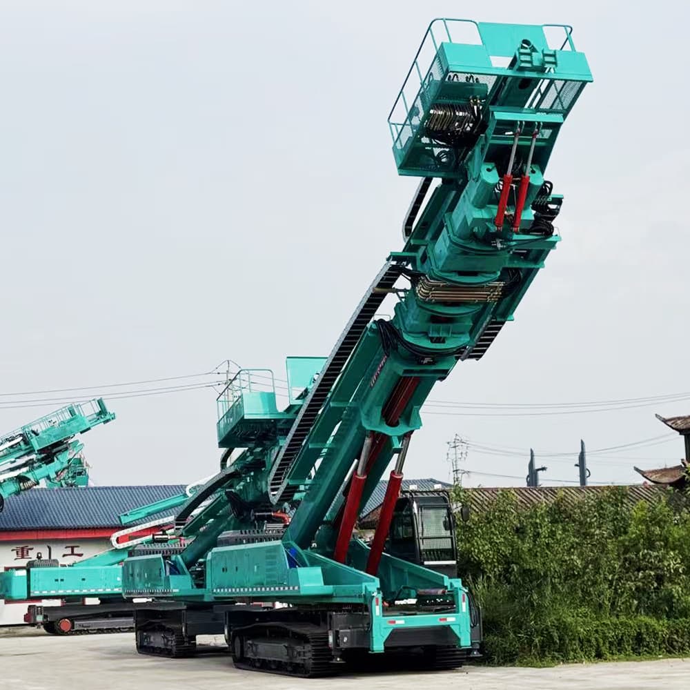Teal crawler slope drilling rig with its lifting structure fully visible in a supplier yard
